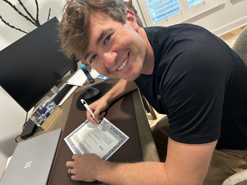 Michael signing Ownership certificate
