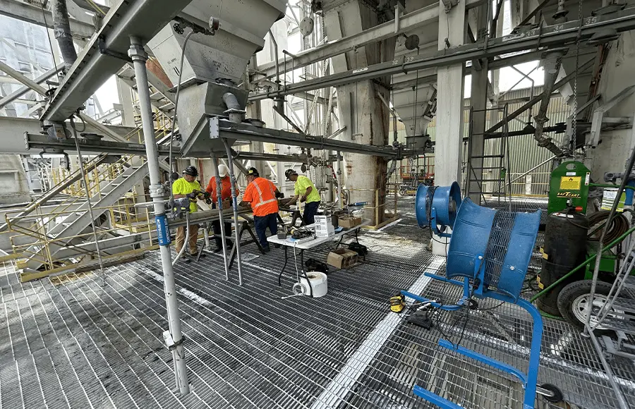 Industrial team working on machinery setup