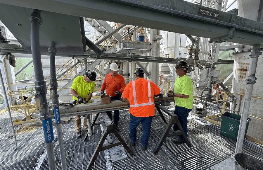 Team working on industrial equipment